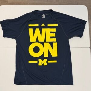 Adidas Mens University of Michigan 
 Blue T-Shirt with Yellow Print